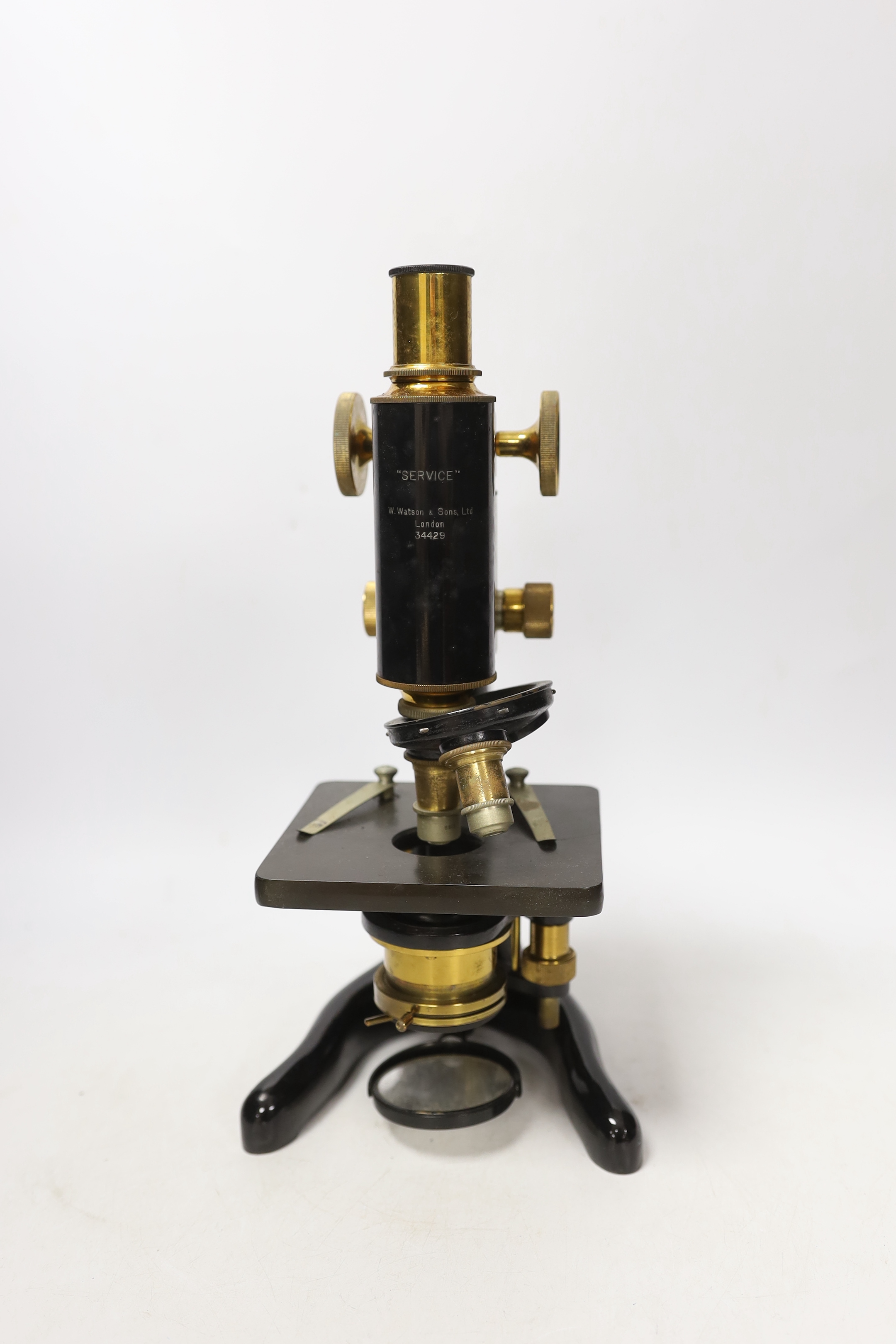 A mahogany cased 'service' microscope, marked W. Watson & Son Ltd., London and numbered 34429, with alternative lens in fitted compartments, case 34cm high